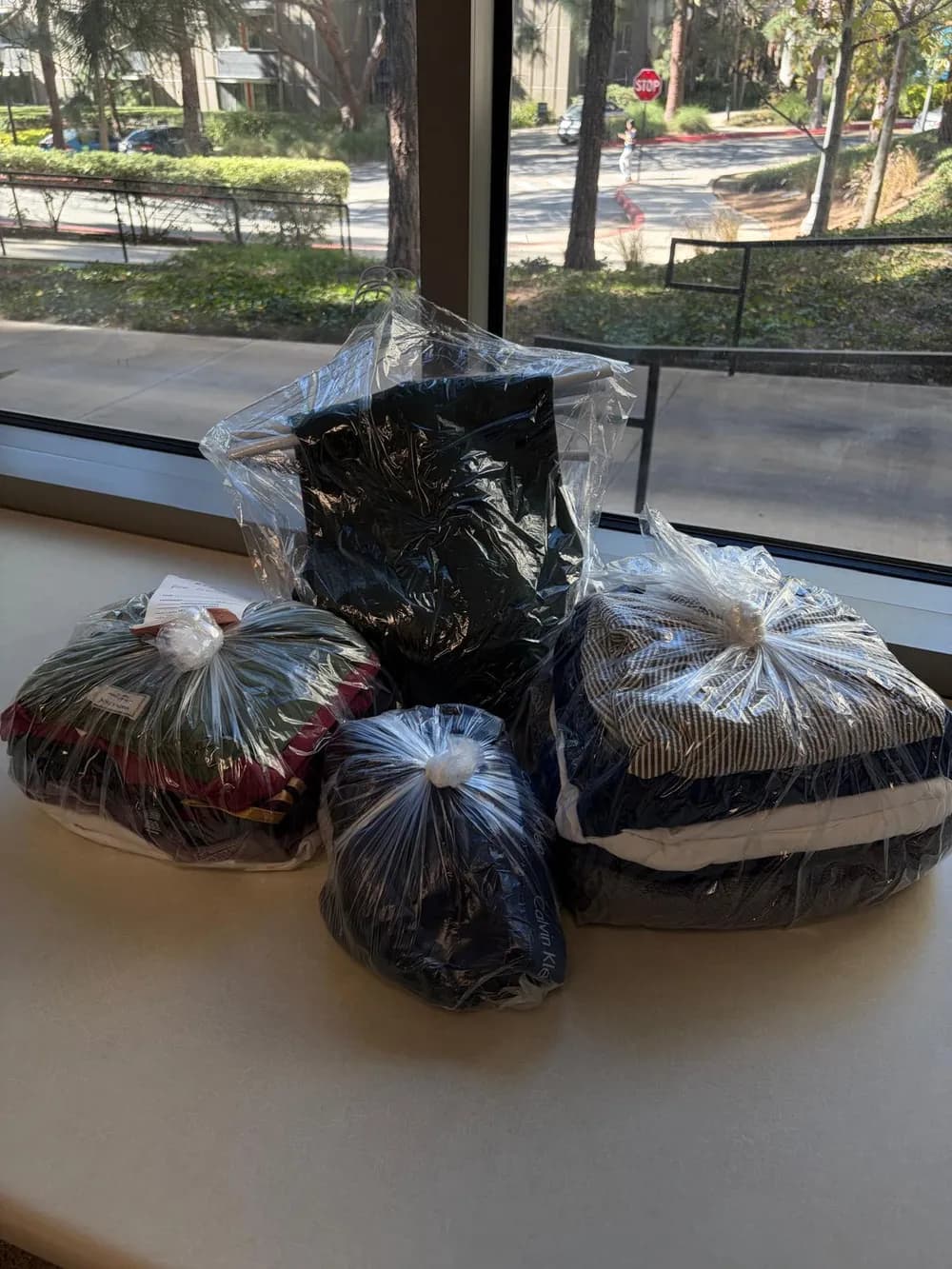 Freshly folded laundry wrapped and delivered on a windowsill overlooking UCLA
