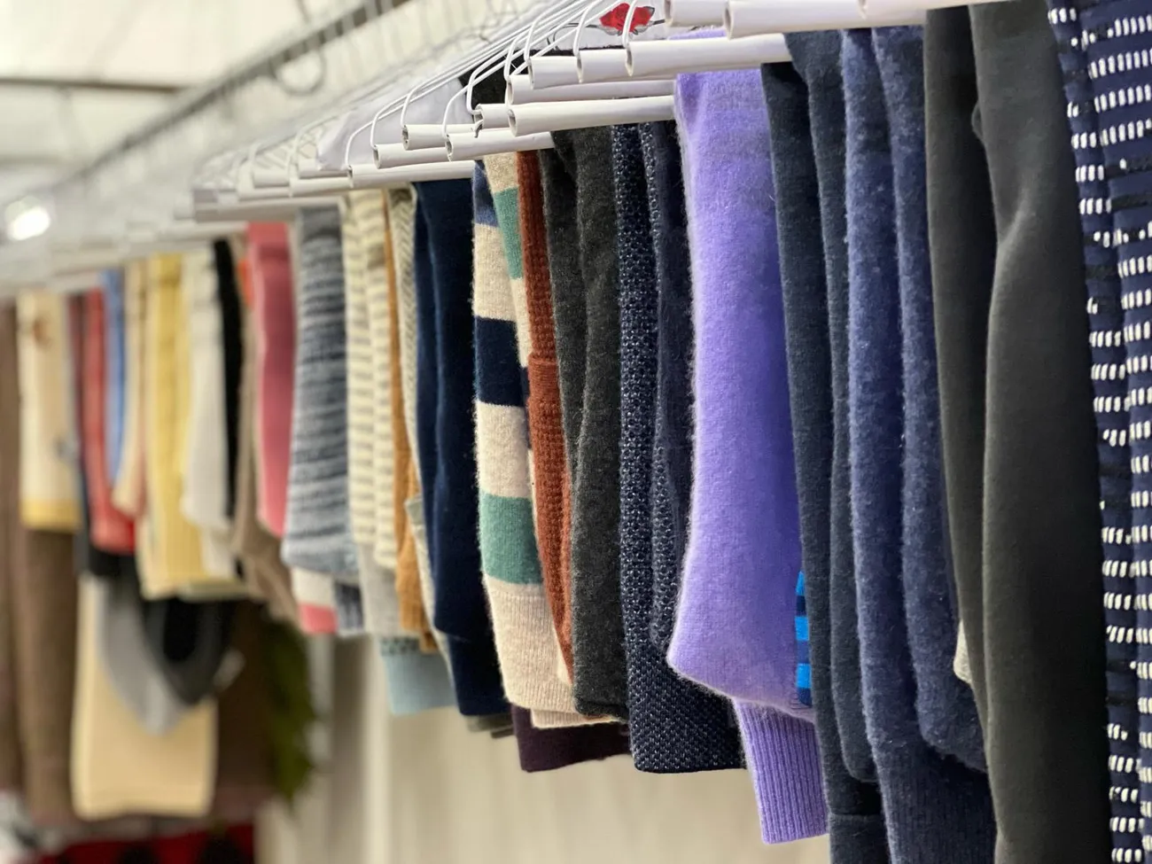 Knitwear and sweaters hang-drying with care at Fold